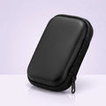 Pocket Retro travel case in black, closed, showing the zip and pull tab
